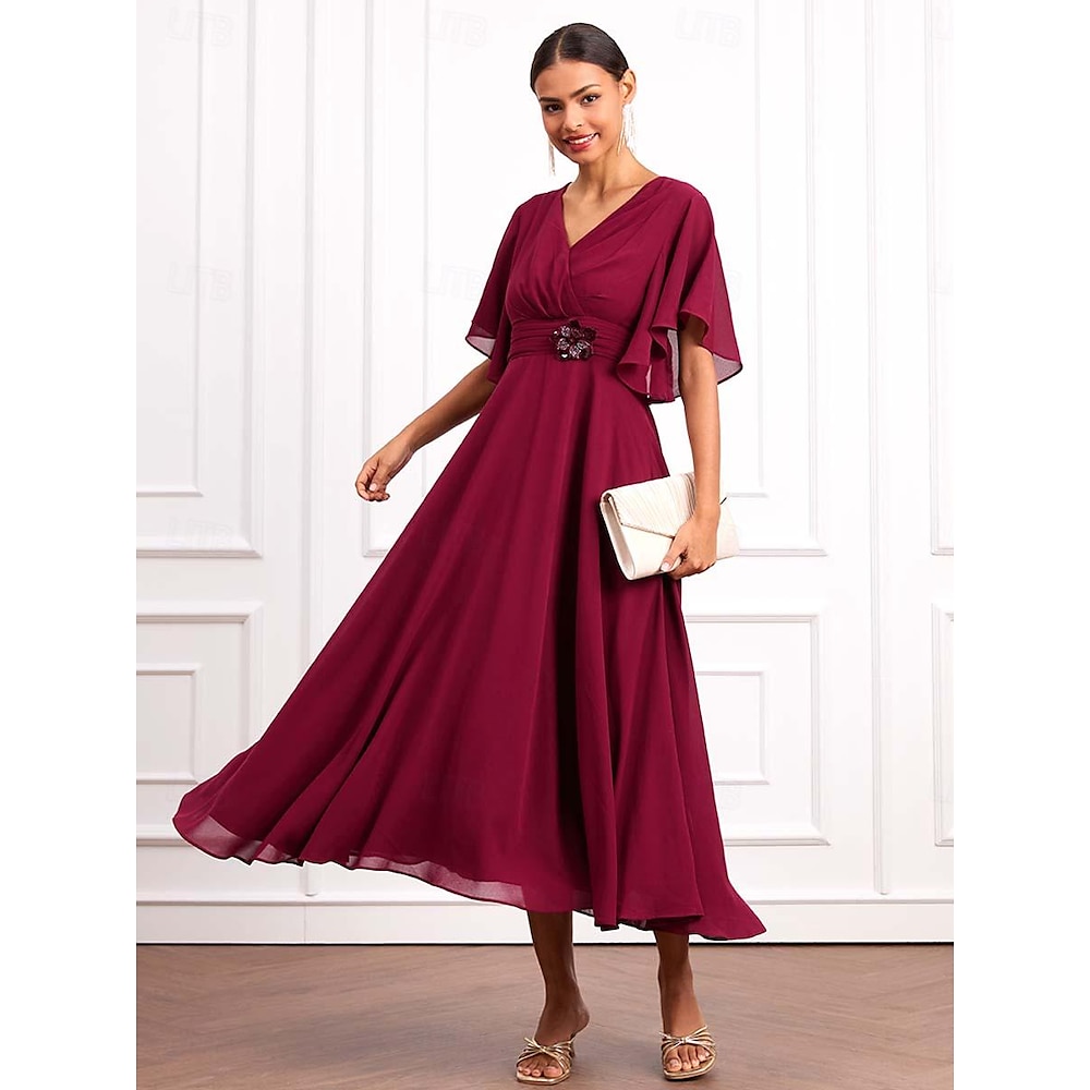 Women's cocktail dress for wedding guests. Wrap dress.