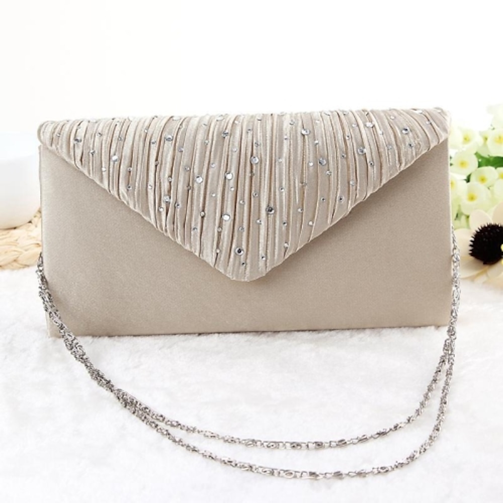 Women's beige satin evening clutch with rhinestone embellishments - elegant fold.