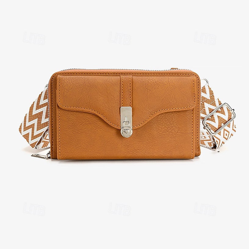 Women's crossbody bag in faux leather with a geometric pattern strap.