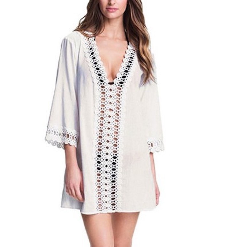 Beach cover-up with sexy lace and crochet detailing and three-quarter sleeves.