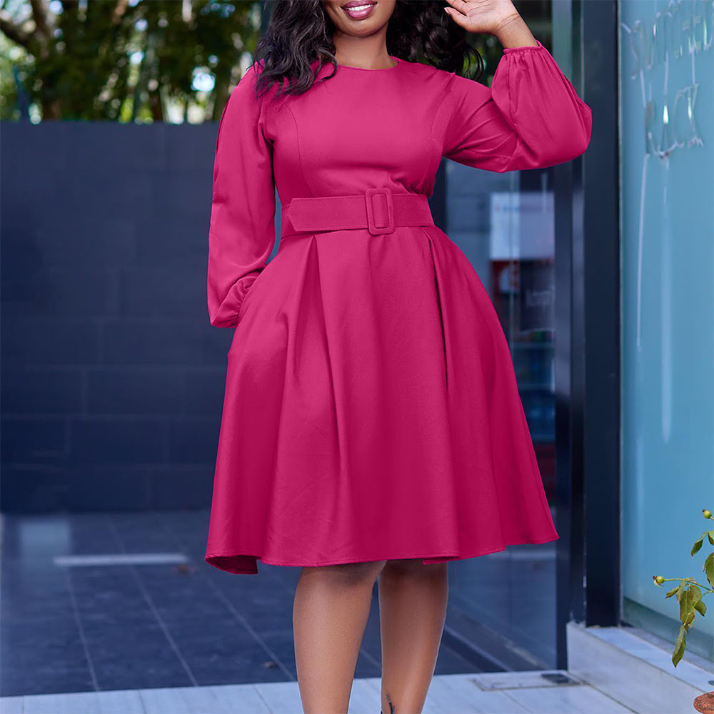 D418 Women's long-sleeved dress with lantern sleeves, belt, and round neck.